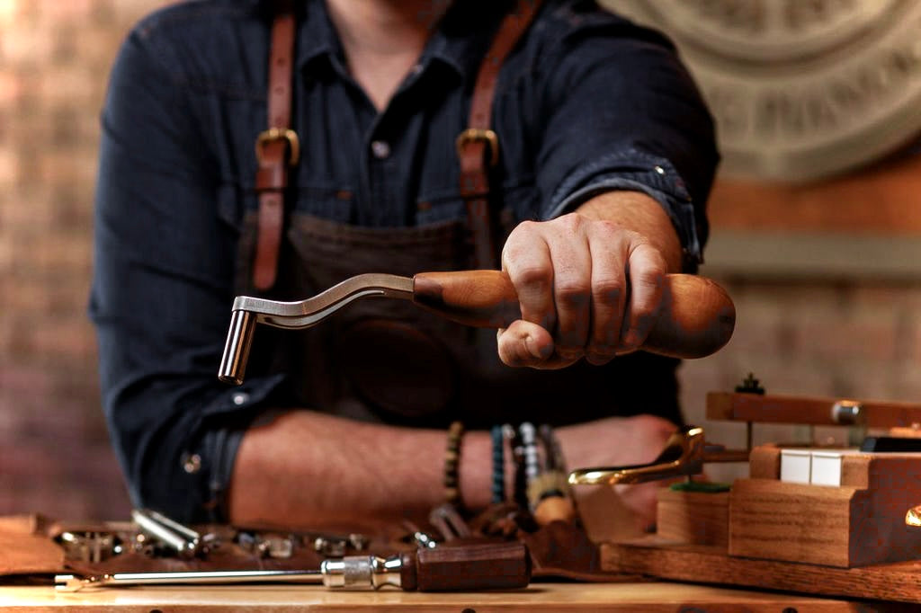 Piano Technician holding a Tuning Lever