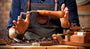 Picture of Piano Technician holding a Tuning lever and Piano Technician Tools